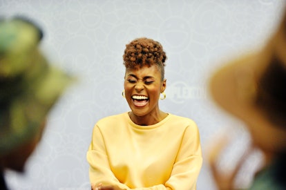 Issa Rae laughs with a brown-red frohawk haircut, a perfect look for cute, short haircut