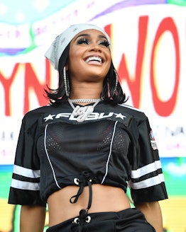 Saweetie performs with her hair cut into a short '70s flip haircut