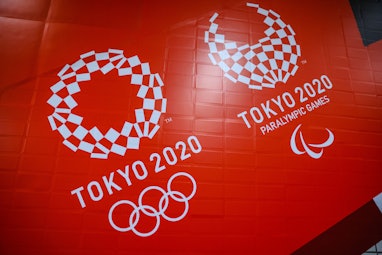 TOKYO, JAPAN - 2021/06/25: Tokyo 2020 Olympic and Paralympic Games branding inside a subway station ...