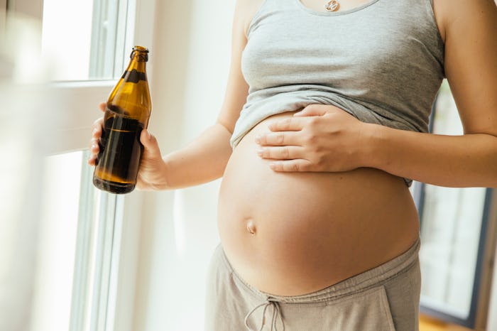 pregnant woman with non-alcoholic beer