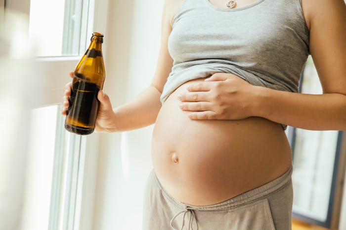 pregnant woman with non-alcoholic beer