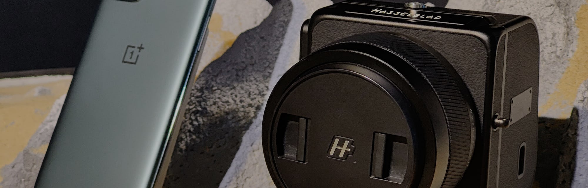 SHANGHAI, CHINA - MARCH 24: A OnePlus 9 pro smartphone and a Hasselblad camera are on display during...