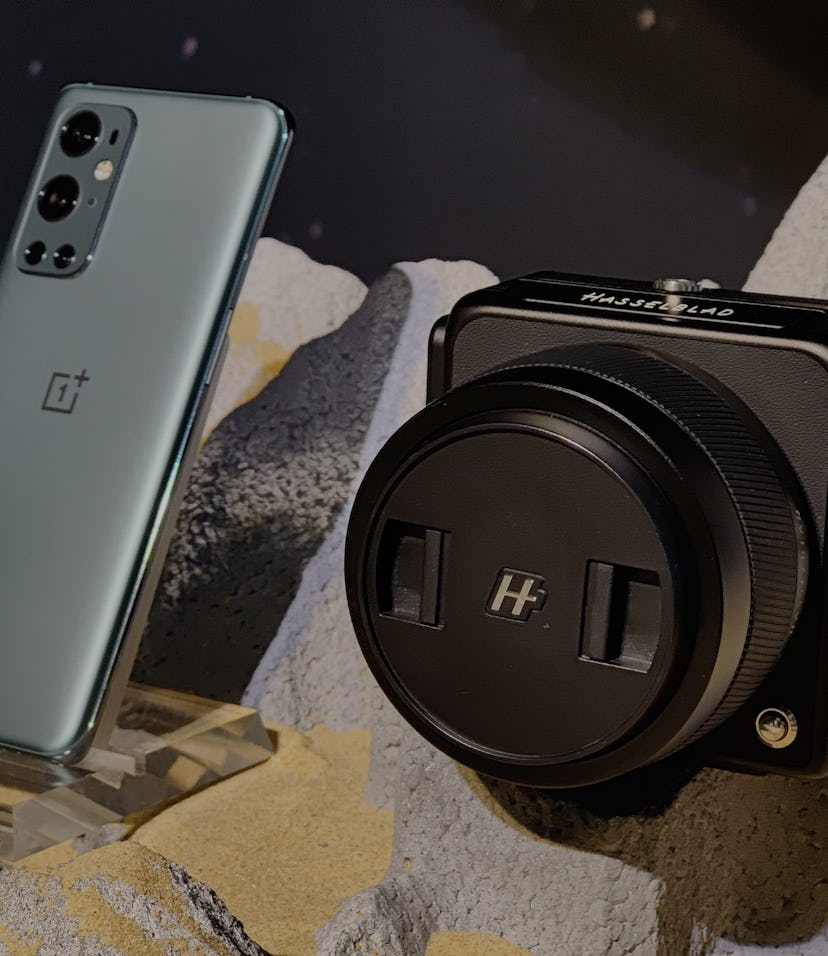 SHANGHAI, CHINA - MARCH 24: A OnePlus 9 pro smartphone and a Hasselblad camera are on display during...