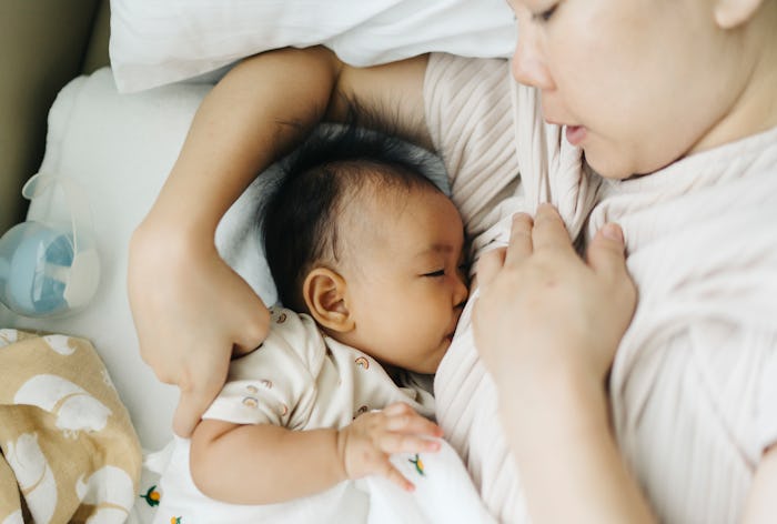 woman breastfeeding baby