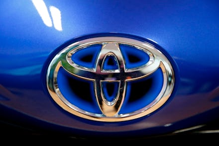 The Toyota company logo is seen on a Yaris model car that is on display at Toyota's automobile manuf...