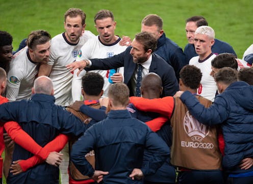 LONDON, ENGLAND - JULY 07: England manager Gareth Southgate talks to his players during the half tim...