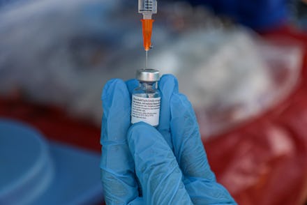 ANKARA, TURKEY - 2021/07/08: A nurse prepares a dose of the vaccine.
Seasonal agricultural workers i...