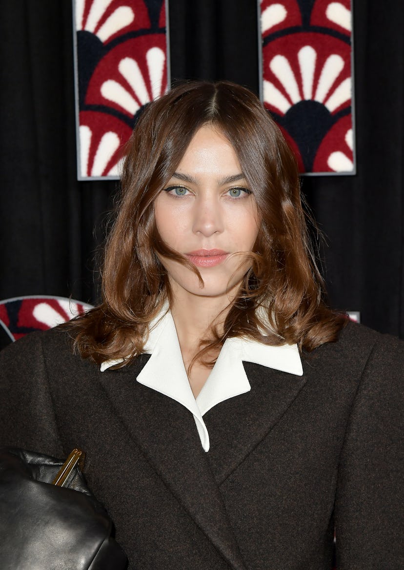 Alexa Chung sports her signature shag cut at a Miu Miu fashion show. 