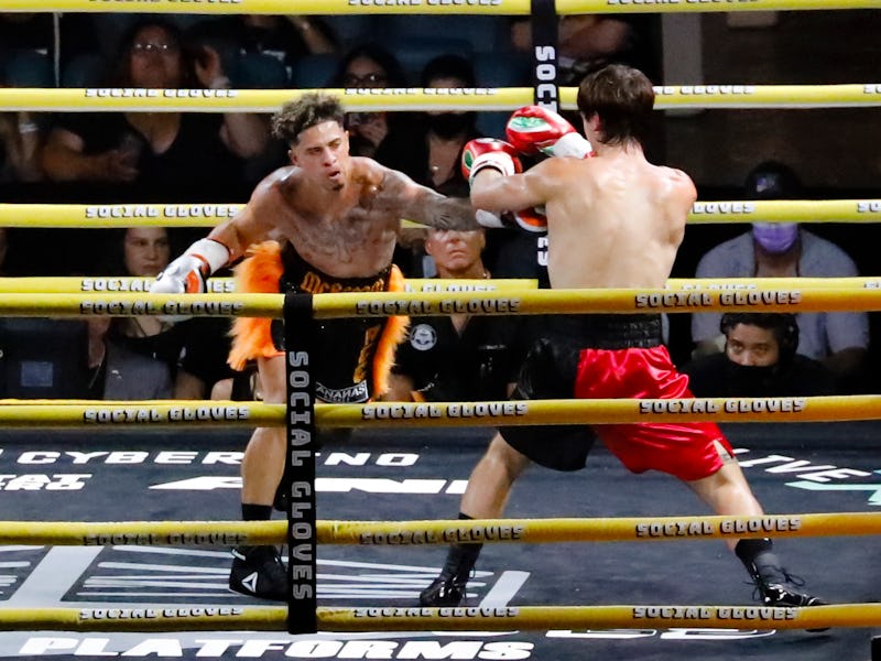 YouTube personality Austin McBroom (L) and TikTok personality Bryce Hall fight during the "Social Gl...