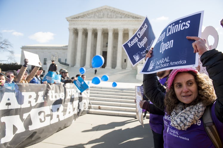 Supporters of legal access to abortion, as well as anti-abortion activists, rally outside the Suprem...