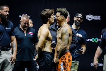 TikTok personality Bryce Hall (L) and YouTube personality Austin McBroom face-off during their weigh...