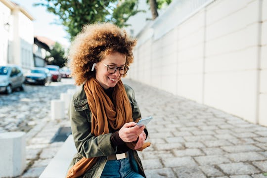 woman listening to mom podcast on headphones