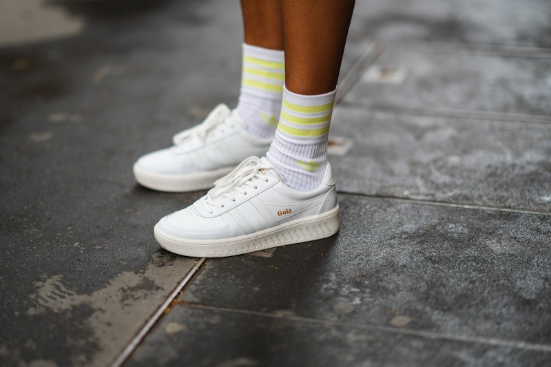 PARIS, FRANCE - JULY 11: Emilie Joseph @in_fashionwetrust wears white with pale yellow strips socks ...