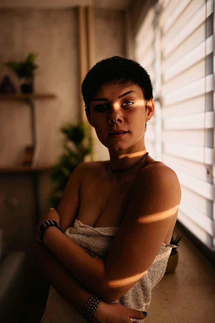 young woman gazing into camera as she anticipates the spiritual meaning of the fall equinox