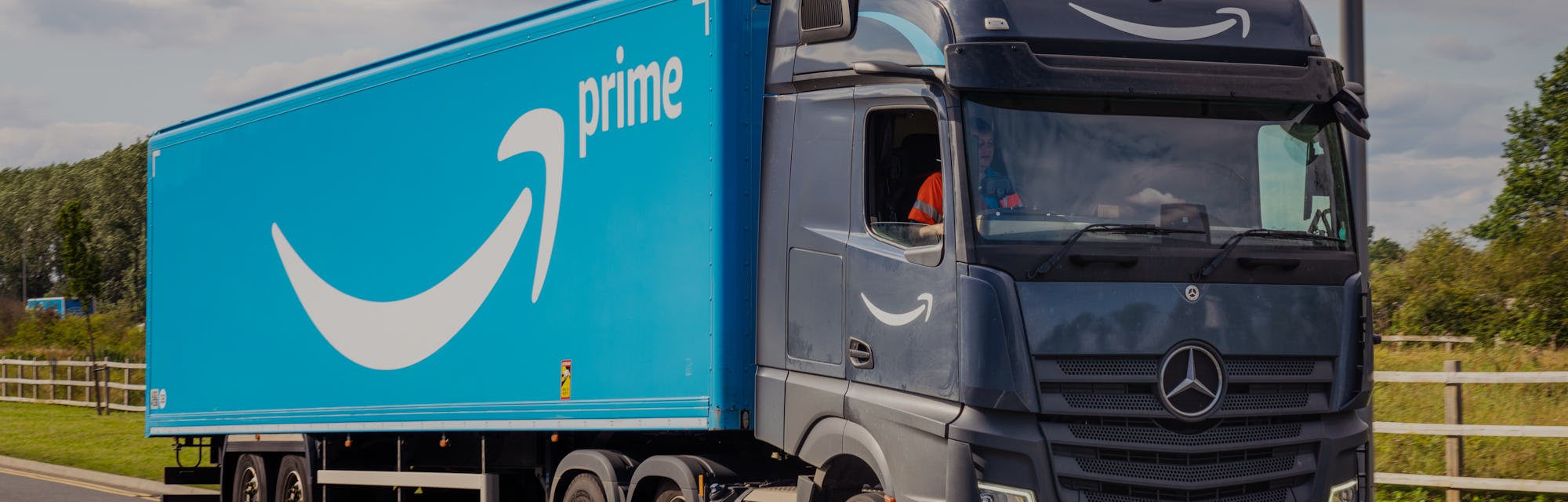 Milton Keynes, UK - A large Amazon Prime delivery lorry on the road.