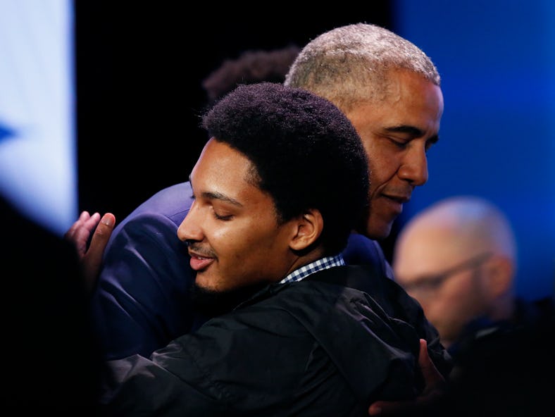 Former President Barack Obama hugs a young man following his town hall conversation at the My Brothe...
