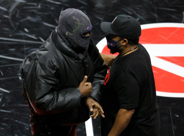 LAS VEGAS, NEVADA - JULY 17:  Rapper Kanye West (L) and BIG3 Co-Founder Ice Cube talk after a game b...