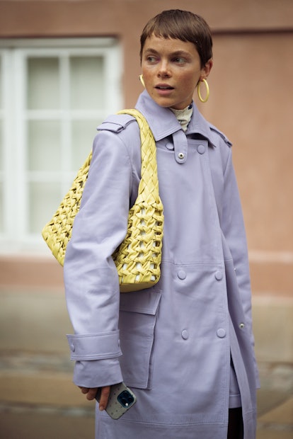 COPENHAGEN, DENMARK - AUGUST 10: Emma Fridsell wearing light purple leather shorts and a coat with l...