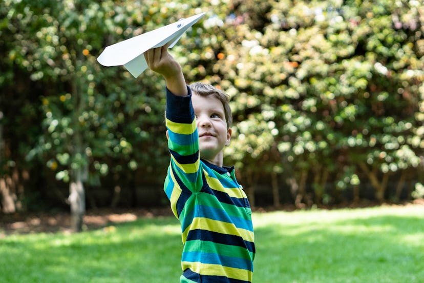 Playing with paper airplanes is one summer activity for kids at home.