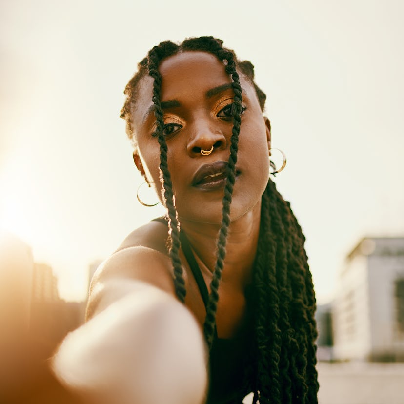 Young woman looking at the camera wondering the zodiac signs who will be affected by the September 2...