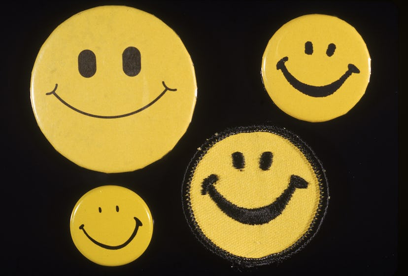 Four different Smiley face buttons, 1970s