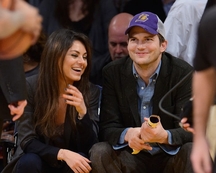 LOS ANGELES, CA - JANUARY 03:  Ashton Kutcher (R) and Mila Kunis attend a basketball game between th...