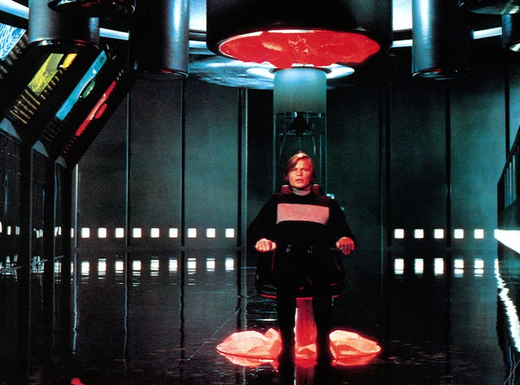Michael York sits in a chair in a scene from the film 'Logan's Run', 1976. (Photo by Metro-Goldwyn-M...