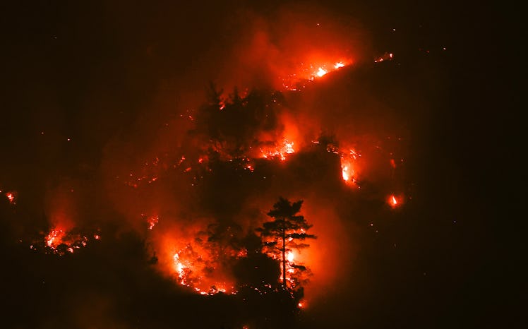 BURDUR, TURKEY - AUGUST 11: Flames rise after a forest fire broke out in Bucak district of Burdur, T...