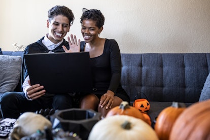 Two friends celebrate Halloween virtually, and smile for a picture that would go well with Halloween...