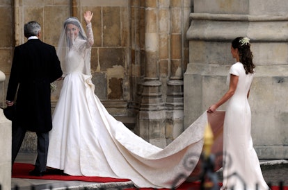 Kate Middleton waves as she arrives with her father Michael Middleton and her sister Philippa Middle...