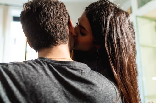 woman kissing guy on the cheek