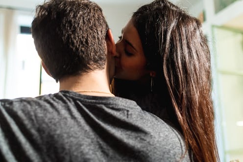 woman kissing guy on the cheek