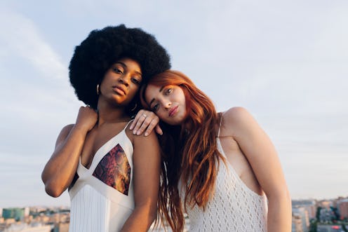 two woman posing 