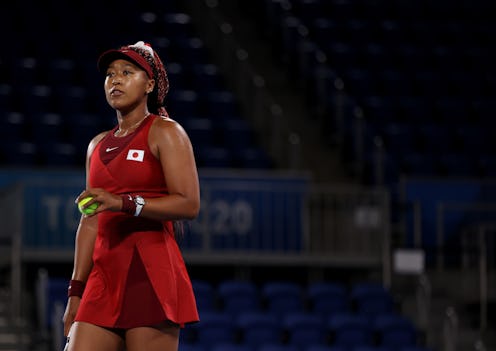 TOKYO, JAPAN - JULY 27: Naomi Osaka of Team Japan prepares to serve during her Women's Singles Third...