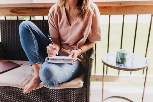 woman writing in a notebook