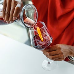 woman pouring wine in a glass
