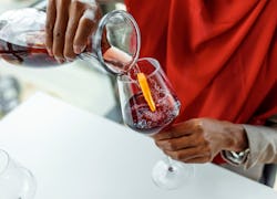 woman pouring wine in a glass