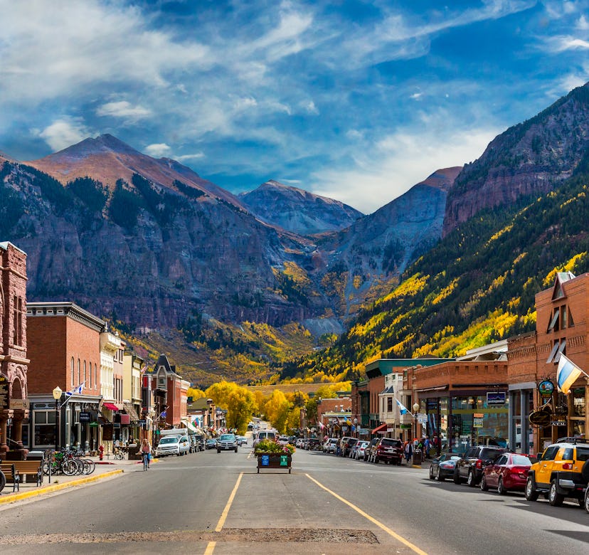 A look down Main Street in Telluride during Peak Autumn Color from the Aspens with a mountain backdr...