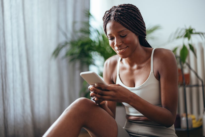 woman texting at home