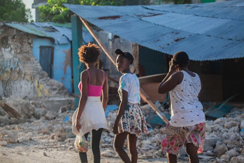 Haitians walk the street after a 7.2-magnitude earthquake on August 15, 2021. Here are places to don...