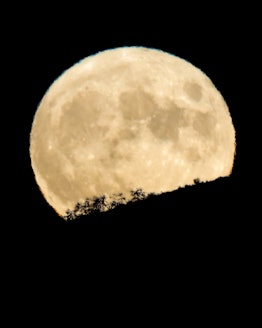 Boise, ID, USA - July 23, 2021: July full moon also known as Buck Moon rises over Boise Idaho sky in...