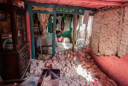 LES CAYES, HAITI - AUGUST 16: A man cleans the debris at his house after a 7.2-magnitude earthquake ...