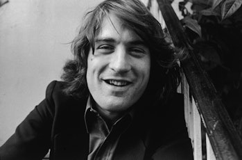 November 1973:  Headshot portrait of American actor Robert De Niro with shaggy hair, smiling.  (Phot...
