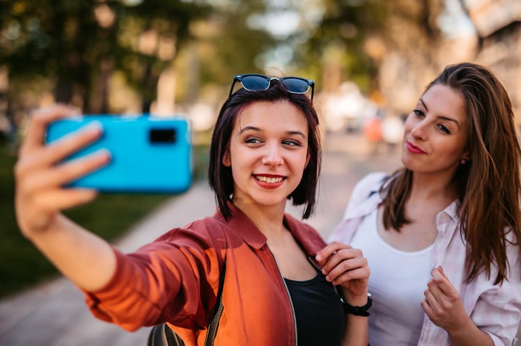 Two friends take a selfie, like during sorority recruitment week, which is why you need rush caption...