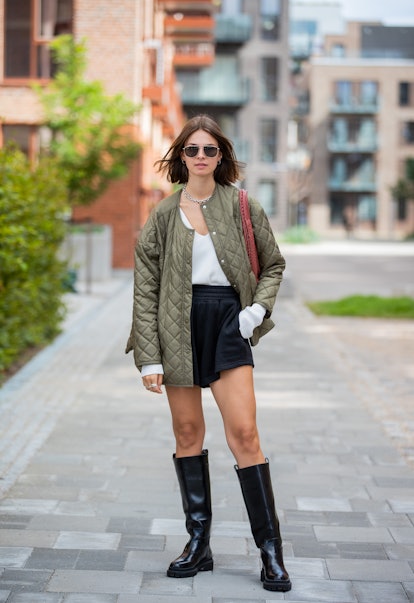 COPENHAGEN, DENMARK - AUGUST 11: Jacqueline Zelwis seen wearing olive puffer jacket, shorts, black b...