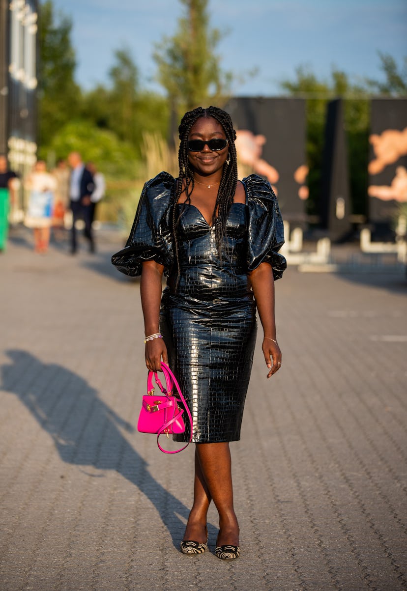 COPENHAGEN, DENMARK - AUGUST 12: Lois Opoku seen wearing black dress, pink Hermes bag outside Rotate...