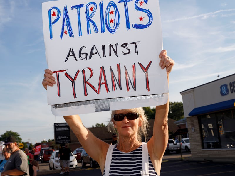 WORTHINGTON, OHIO, UNITED STATES - 2021/08/14: A protester holds sign advocating against businesses ...