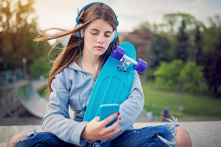 Woman listens to songs about falling out of love. 