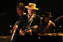 US singer and musician Bob Dylan (C) performs at the Feis Festival in London on June 18, 2011. AFP P...