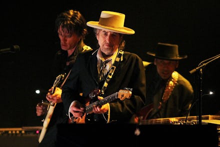 US singer and musician Bob Dylan (C) performs at the Feis Festival in London on June 18, 2011. AFP P...